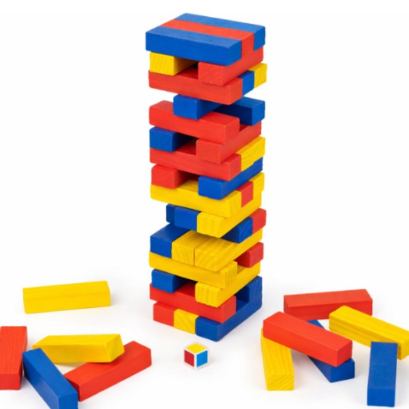 Close-up of die included with Rainbow Wooden Jumbling Tower game