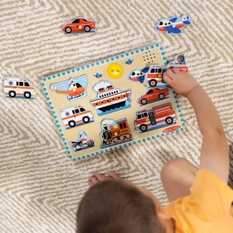 Close-up of vehicle puzzle pieces removed from board