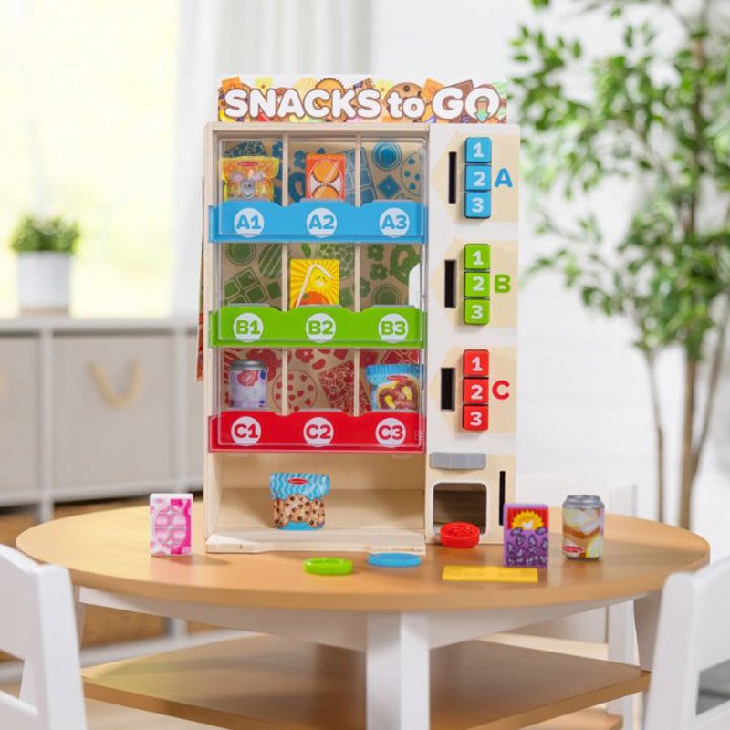 Melissa & Doug wooden vending machine play set with snacks, drinks, and coins displayed