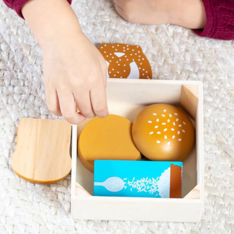 Close-up of wooden bread and pretzel pieces from Food Groups Grains set